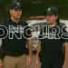 Dois Guardas Municipais fardados (homem e mulher) com coletes de proteção, representando o novo concurso público para quase 600 vagas na segurança.