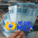 Cédulas de 100 reais e logo do programa Pé-de-Meia, que ilustra o pagamentos aos concluintes do ensino médio em 2026.
