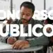 Homem escrevendo em prova com texto "Concursos Públicos" em destaque.