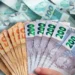 Notas de 50, 100 e 200 reais ilustrando o saque de mais de R$ 6 mil liberados pela CAIXA para CPFs com finais de 0 a 9 em 27 de janeiro de 2026.