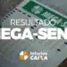 Volante preenchido da Mega-Sena ao lado de caneta com destaque para o resultado.